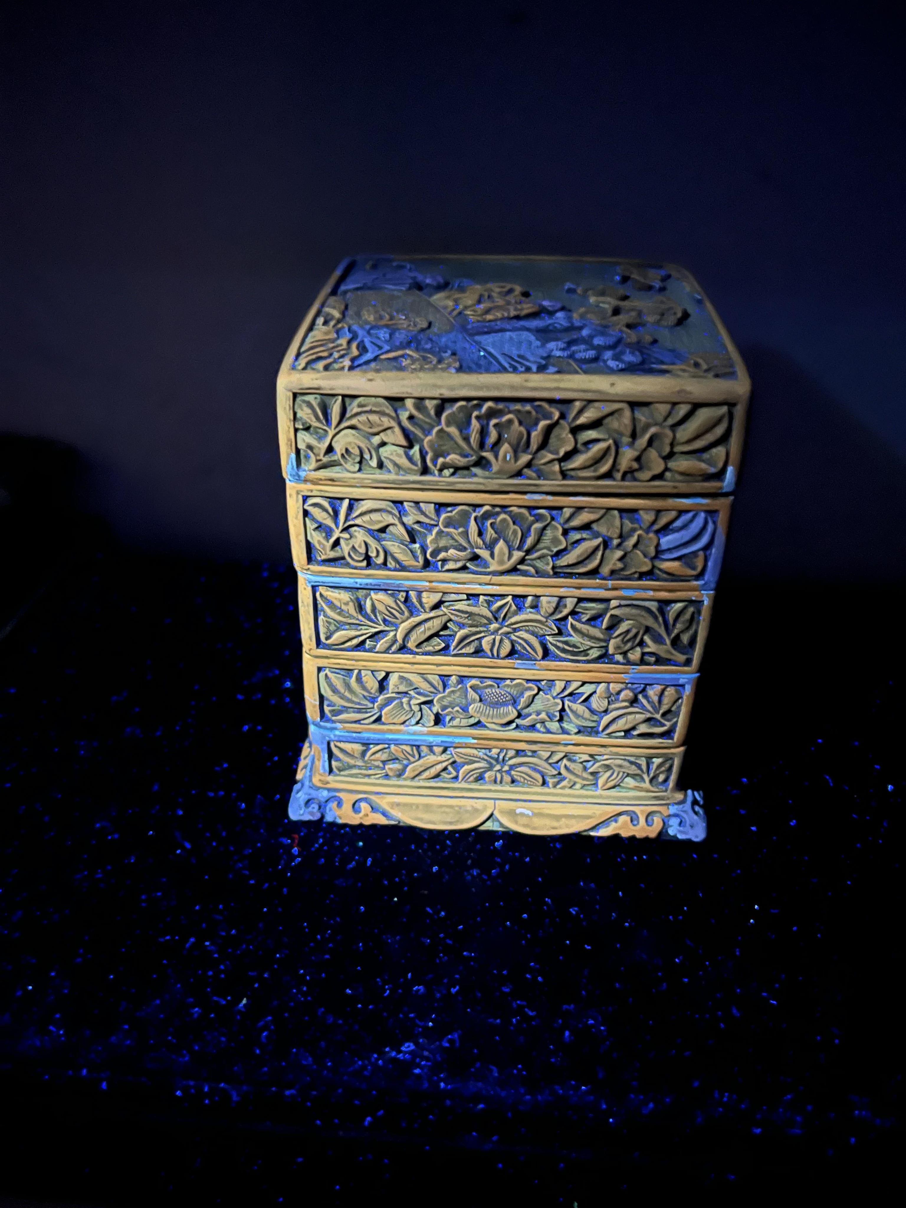 A Chinese Ming cinnabar lacquer four tier box, 15th century